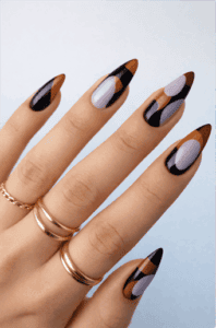 Abstract black and brown almond-shaped nails with glossy finish and soft lavender geometric accents on long natural nails
