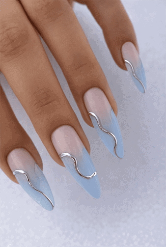 Light blue ombre almond nails with nude base and silver chrome wave accents, glossy modern minimalist nail design