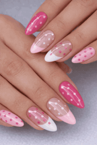 Pink and white almond nails with polka dot design and glossy finish, romantic minimalist nail art with sheer nude accents