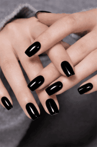 Short square-shaped nails with solid glossy black polish, clean minimal style with high-shine finish, classic versatile everyday nail look