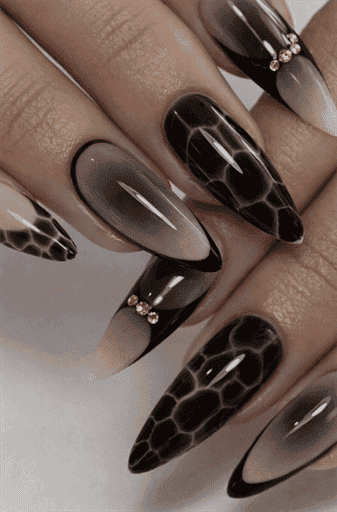 Long almond nails with smoky black ombre and tortoiseshell pattern, glossy layered effect with rich depth and luxury gradient design