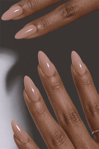Short almond nails with solid glossy nude polish, clean minimal design with smooth high-shine finish, classic everyday neutral manicure look