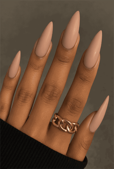 Long almond-shaped nails with soft matte nude finish, smooth velvety texture with minimalist aesthetic, modern neutral nail design for everyday wear
