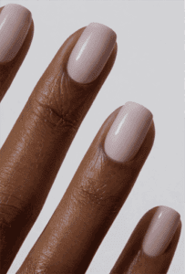 Short square nails with soft milky pink nude polish, glossy finish with clean minimal aesthetic, natural everyday manicure look