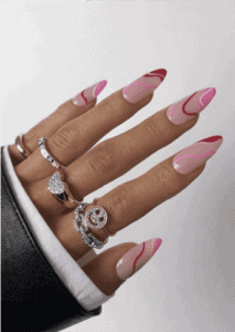 Almond-shaped nails with nude base and flowing pink and red wave French tips, abstract swirl design with glossy finish and modern artistic aesthetic