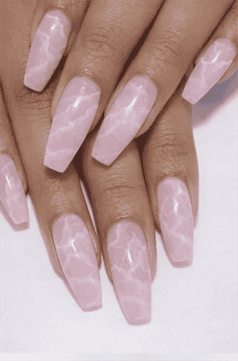 Long coffin nails with soft pink marble pattern, subtle white veining with glossy finish and elegant minimalist stone-inspired nail design