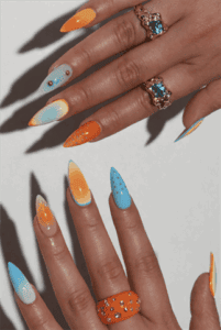 Blue and orange ombre almond nails with glossy finish, gradient nail art with rhinestone accents on long nails