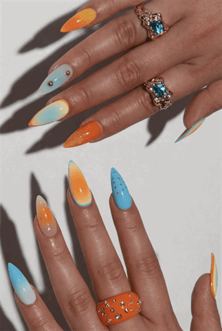 Blue and orange ombre almond nails with glossy finish, gradient nail art with rhinestone accents on long nails