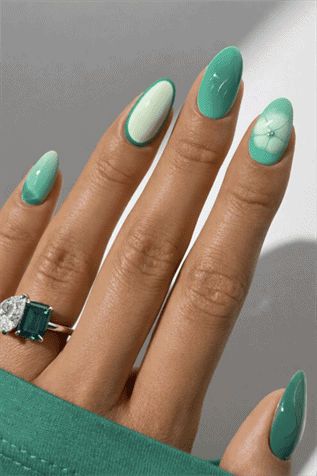 Mint and emerald green almond nails with mix and match design, glossy manicure with floral and gradient accents