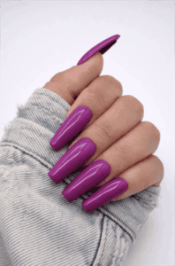 Glossy magenta purple coffin nails with high-shine finish, long acrylic solid color nail design