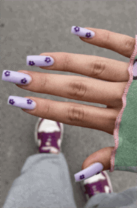 Lavender floral square nails with tiny purple flower design, matte pastel manicure on short nails
