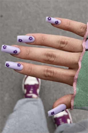 Lavender floral square nails with tiny purple flower design, matte pastel manicure on short nails