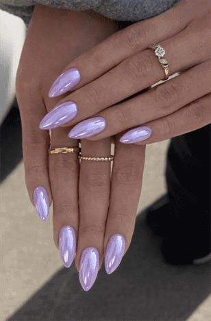 Light lavender chrome almond nails with glossy metallic finish, long iridescent purple manicure design