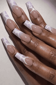 Lilac patterned French tip coffin nails with nude base, glossy long acrylic nails with abstract print design