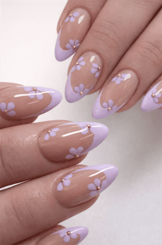 Lilac French tip almond nails with delicate floral nail art on nude base, glossy pastel manicure with small daisy accents