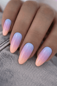 Pastel sunset ombre almond nails with blue, pink and peach gradient, glossy soft blend manicure