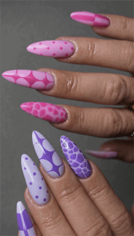 Pink and purple patterned almond nails with polka dots, checkerboard and abstract designs, glossy long manicure