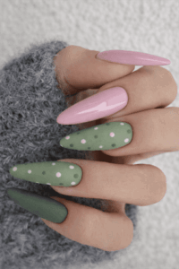 Pink and sage green almond nails with glossy finish and white polka dot design, soft aesthetic matte and glossy manicure