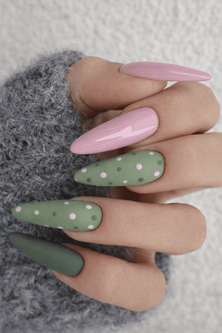 Pink and sage green almond nails with glossy finish and white polka dot design, soft aesthetic matte and glossy manicure