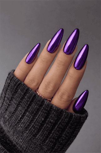 Purple chrome almond nails with mirror metallic finish, glossy long nail design in vibrant violet shade