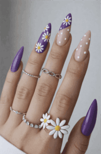 Purple daisy almond nails with floral nail art and white polka dot accent nails, glossy long manicure