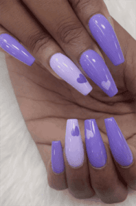 Purple ombre coffin nails with heart accents, glossy long acrylic nails with lavender gradient design