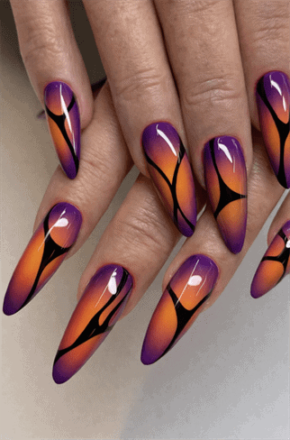 Purple and orange flame gradient stiletto nails with glossy finish, abstract ombre nail design on long nails
