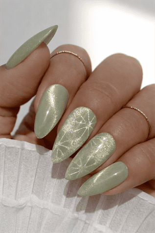 Sage green shimmer almond nails with glossy finish and subtle starburst nail art, elegant soft metallic manicure