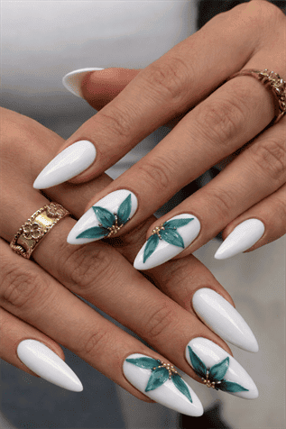 Glossy white almond nails with teal floral nail art and gold accents, elegant long manicure with detailed flower design