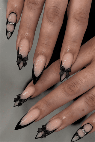 Black bow French tip almond nails with nude base, glossy coquette nail design with 3D bow accents