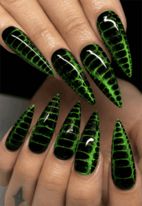 Black and neon green reptile stiletto nails with crocodile texture effect, glossy animal print nail design on long pointed nails