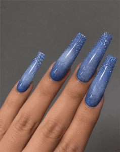 Blue glitter ombre coffin nails with glossy finish, sparkly gradient acrylic nail design on long square nails