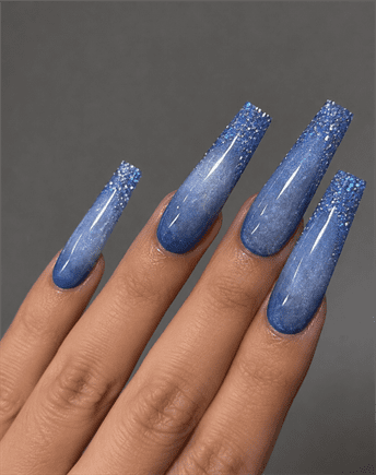 Blue glitter ombre coffin nails with glossy finish, sparkly gradient acrylic nail design on long square nails