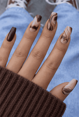 Brown marble swirl nails with glossy finish, mixed neutral nail design with chocolate and beige tones