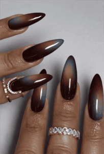 Burgundy aura chrome almond nails with glossy gradient fade, dark red and blue iridescent nail design