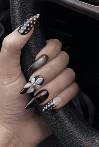 Chocolate brown mix and match stiletto nails with polka dots, chrome accent and 3D flower nail art