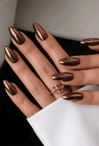 Chocolate chrome almond nails with mirror metallic finish, glossy brown nail design on long nails