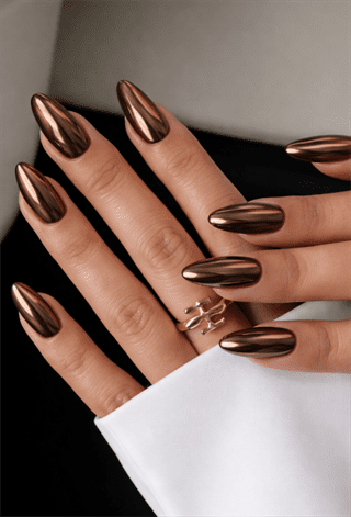Chocolate chrome almond nails with mirror metallic finish, glossy brown nail design on long nails