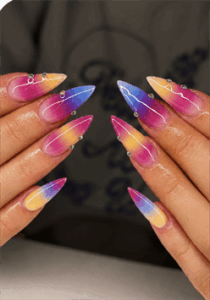 Electric sunset ombre stiletto nails with pink, purple and yellow gradient, glossy aura nail design