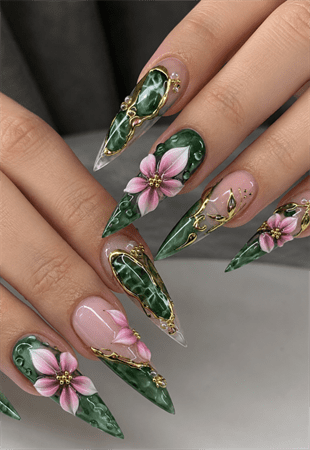 Emerald marble stiletto nails with pink 3D floral accents, luxury gemstone nail design featuring gold detailing and glossy finish