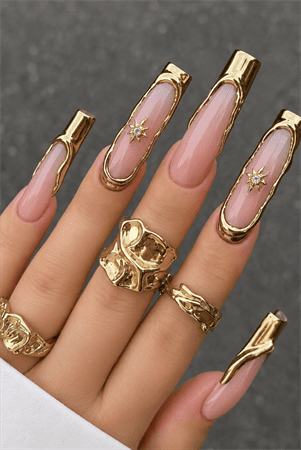Gold chrome outline coffin nails with nude pink base, luxury metallic frame nail design featuring celestial star accents
