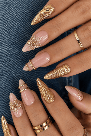 Gold sculpted floral stiletto nails with 3D metallic nail art, luxury nude pink manicure featuring gold chrome accents