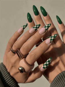 Green checkerboard almond nails with glossy emerald accents, trendy retro nail design on nude pink base