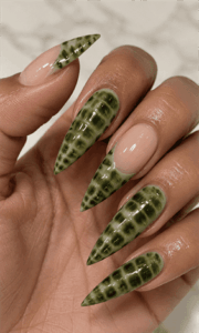 Green crocodile aura stiletto nails with glossy reptile texture, luxury animal print nail design on long pointed nails