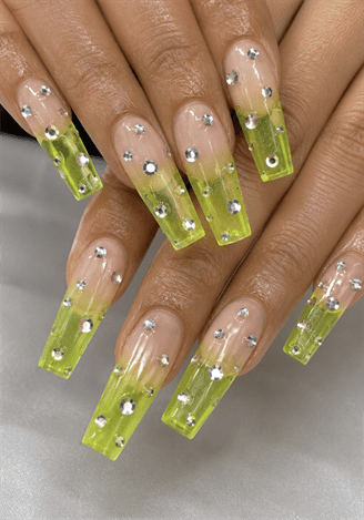 Lime green jelly coffin nails with rhinestone accents, translucent neon French tip nail design on long square acrylic nails