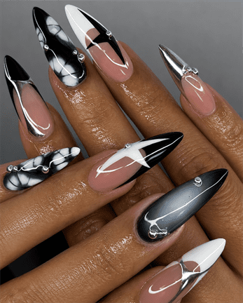 Monochrome chrome stiletto nails with black, white and silver metallic accents, glossy abstract nail design