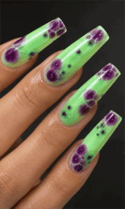 Neon lime green and purple aura coffin nails with glossy jelly finish, abstract bubble nail design on long acrylic nails