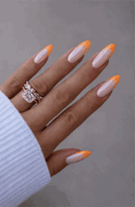 Neon orange chrome French tip almond nails with nude base, glossy metallic tip nail design