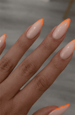 Neon orange French tip almond nails with nude base, glossy minimalist nail design with thin bright tips
