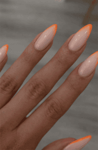 Neon orange French tip almond nails with nude base, glossy minimalist nail design with thin bright tips